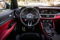 <p>On the inside, the NRINGs have a red-and-black two-tone interior that has been lathered in carbon-fiber trim, including illuminated side sills on the Giulia. </p>
