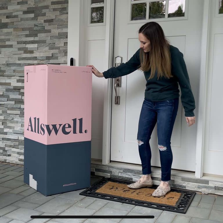 textiles lab executive director lexie sachs with an allswell bed in a box on a porch