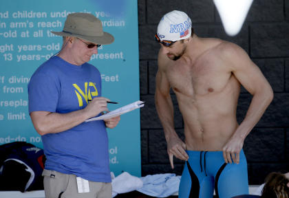 Michael Phelps talks with coach Bob Bowman. (AP)