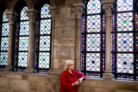 Artist Betsy Ashton poses for a portrait at Riverside Church in New York, U.S., March 10, 2019. Betsy has her "Portraits of Immigrants: Unknown Faces, Untold Stories" on display until April 22, 2019. REUTERS/Demetrius Freeman