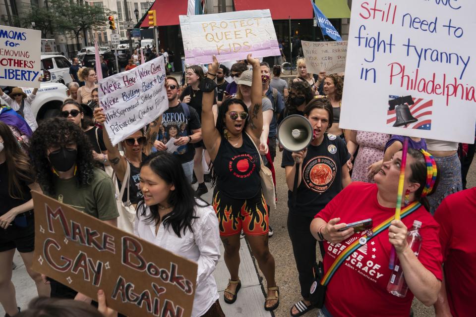 Demonstrators gather outside the Moms for Liberty meeting in Philadelphia, Friday, June 30, 2023. 