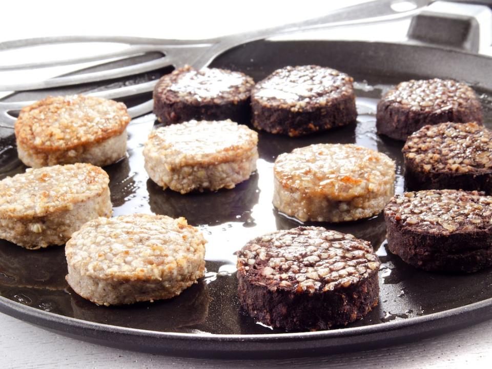 white and black pudding in a frying pan