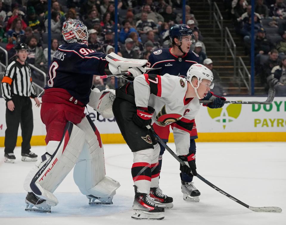 Dec. 1, 2023; Columbus, Ohio, USA; 
Columbus Blue Jackets goaltender Elvis Merzlikins (90) shoves Ottawa Senators left wing Brady Tkachuk (7) in front of the goal during the second period of FridayÕs hockey game at Nationwide Arena.