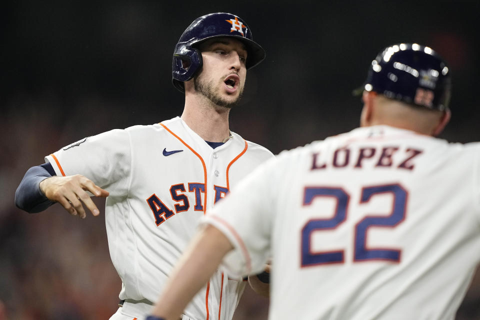 Houston Astros' Kyle Tucker celebrates his three-run home run during the third inning in Game 1 of baseball's World Series between the Houston Astros and the Philadelphia Phillies on Friday, Oct. 28, 2022, in Houston. (AP Photo/David J. Phillip)