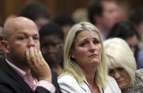 The family members of Reeva Steenkamp react as the verdict is handed down to Olympic and Paralympic track star Oscar Pistorius (unseen) at the North Gauteng High Court in Pretoria September 12, 2014.REUTERS/Alon Skuy/Pool