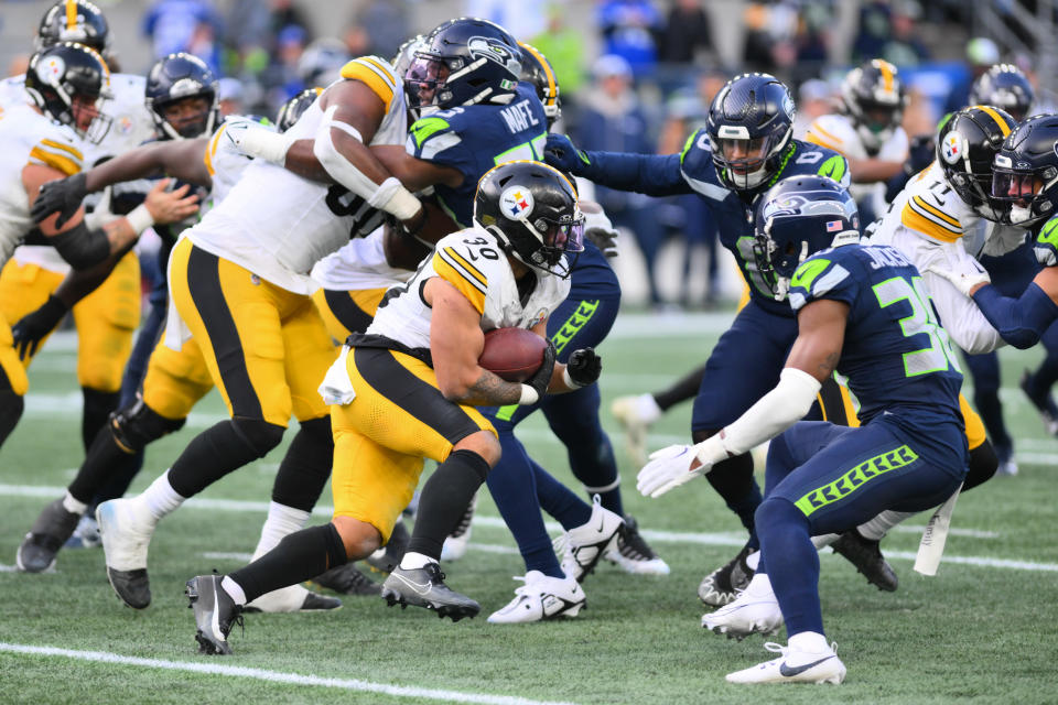 Dec 31, 2023; Seattle, Washington, USA; Pittsburgh Steelers running back Jaylen Warren (30) carries the ball against the Seattle Seahawks during the second half at Lumen Field. Mandatory Credit: Steven Bisig-USA TODAY Sports