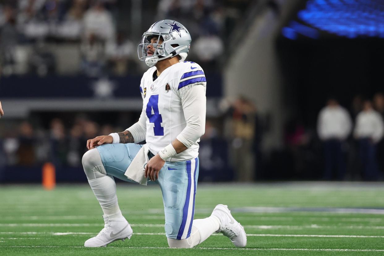 Dallas Cowboys quarterback Dak Prescott (4) reacts after a play against the Green Bay Packers during the second half for the 2024 NFC wild card game at AT&T Stadium.
