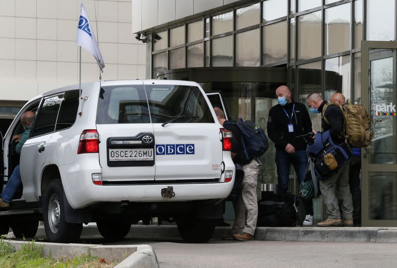 OSCE members leave a hotel in Donetsk