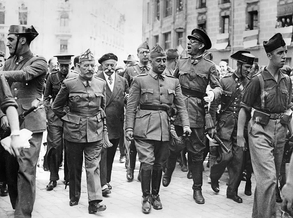 General Francisco Franco, commander in the south, is visiting the headquater of the Northern Front in Burgos. F.l.t.r.: General Cavalcanti, General Francisco Franco Bahamonde and the Nationalist commander in the north General Emilio Mola Vidal (with glass