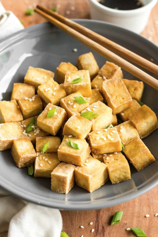 <p>Dish by Dish</p><p>This recipe for air fryer tofu is crazy easy, the tofu cooks so quickly and uses so little oil. Gluten-free and vegan.</p><p><strong>Get the recipe: <a href="https://www.dishbydish.net/easy-air-fryer-tofu/" rel="nofollow noopener" target="_blank" data-ylk="slk:Easy Air Fryer Tofu;elm:context_link;itc:0;sec:content-canvas" class="link "><em>Easy Air Fryer Tofu</em></a></strong></p>