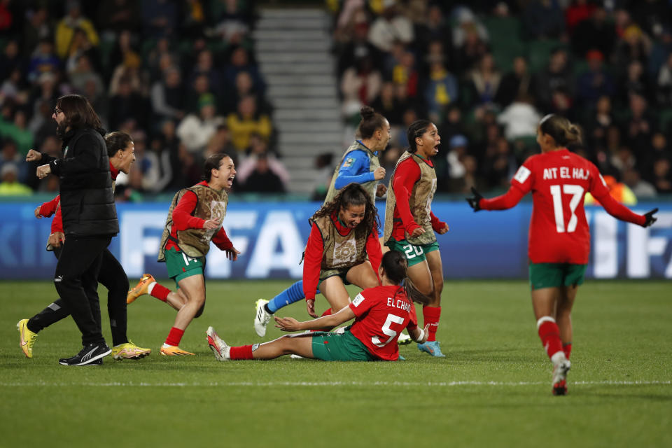 Morocco's head coach Reynald Pedros, left, and his players celebrate after the Women's World Cup Group H soccer match between Morocco and Colombia in Perth, Australia, Thursday, Aug. 3, 2023. (AP Photo/Gary Day)
