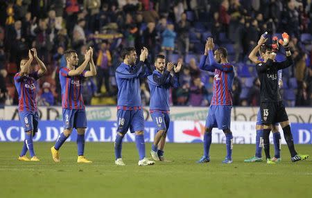 Levante's players celebrate their victory over Valencia after their Spanish first division soccer match at the Ciudad de Valencia stadium in Valencia, November 23, 2014. REUTERS/Heino Kalis