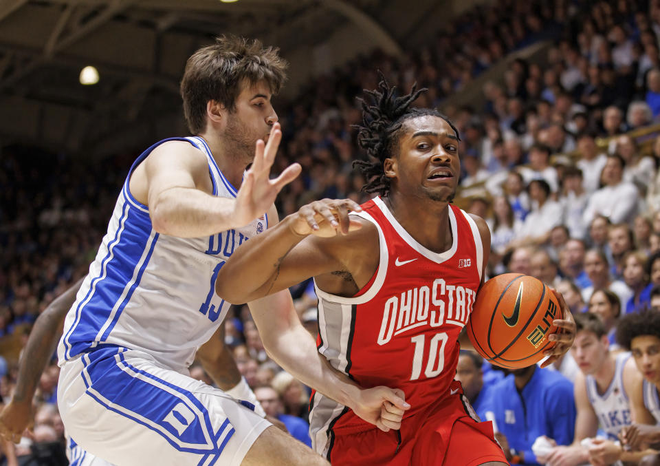 Ohio State's Brice Sensabaugh (10) drives against Duke's Ryan Young (15) during the first half of an NCAA college basketball game in Durham, N.C., Wednesday, Nov. 30, 2022. (AP Photo/Ben McKeown)