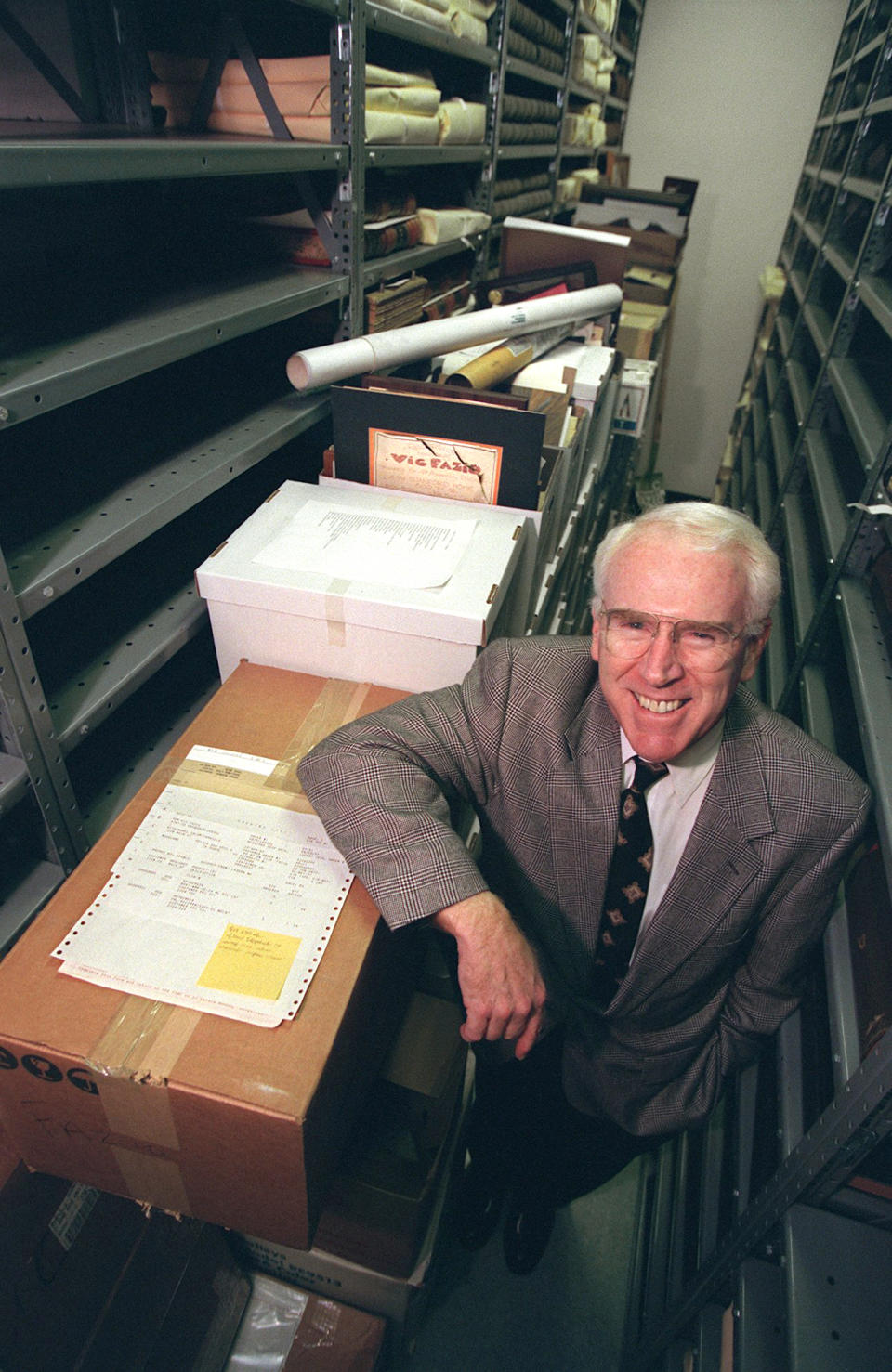 Former U.S. Congressman Vic Fazio stands inside the Shields Library at University of California, Davis, on Feb. 12, 1999, in Davis, Calif., with boxes of his legal papers which he donated to the school. Fazio, a Democratic congressman from California who served for 20 years and rose to become an influential party leader in the House, has died. Fazio's death was announced Wednesday, March 26, 2022, by House Speaker Nancy Pelosi, although her office didn't provide details. He was 79. (Randy Pench/The Sacramento Bee via AP)