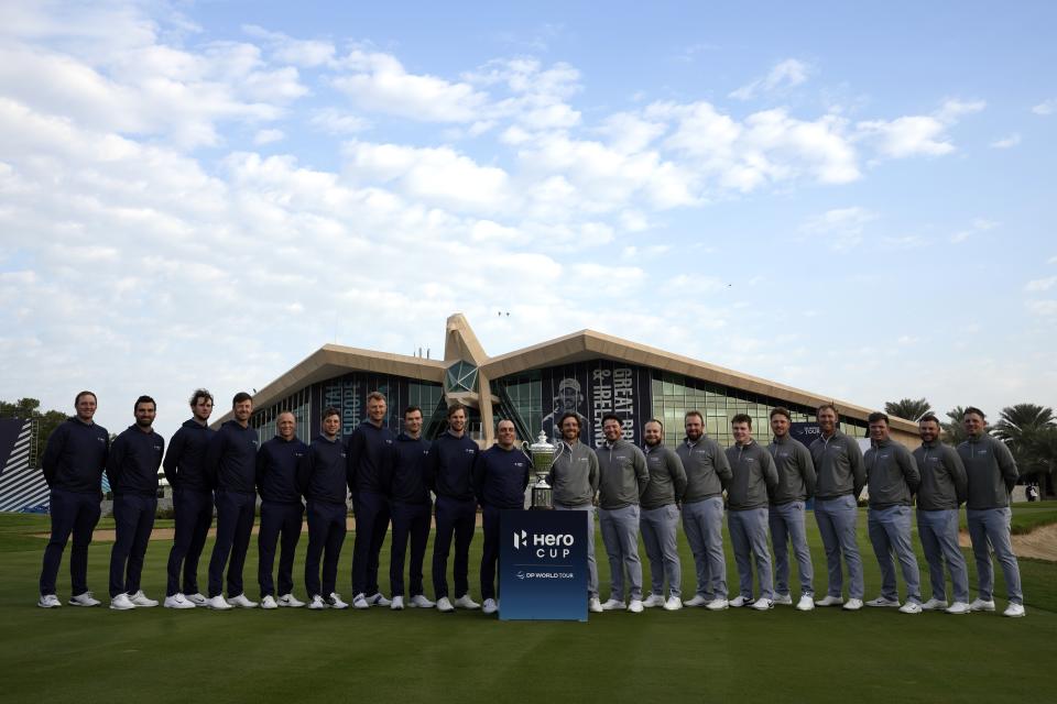 From left to right, Sepp Straka, Antoine Rozner, Thomas Pieters, Victor Perez, Alex Noren, Guido Migliozzi, Adrian Meronk, Nicolai Højgaard, Thomas Detry, Francesco Molinari of Continental Europe and Tommy Fleetwood, Ewen Ferguson, Tyrrell Hatton, Shane Lowry, Robert MacIntyre, Richard Mansell, Séamus Power, Callum Shinkwin, Jordan Smith and Matt Wallace of Great Britain, pose with the trophy, ahead of the first day of the Hero Cup, at Abu Dhabi Golf Club, United Arab Emirates, Friday, Jan. 13, 2023. (AP Photo/Kamran Jebreili)