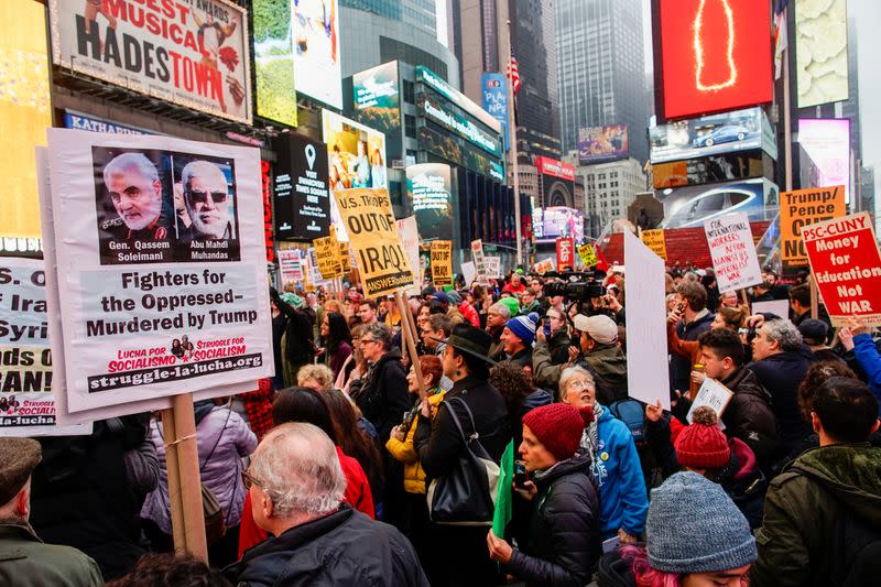 People take part in an anti-war protest amid increased tensions between the United States and Iran at Times Square in New York