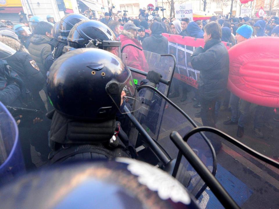 Demonstrators confront police during an anti-fascism demonstration in Milan (Reuters)