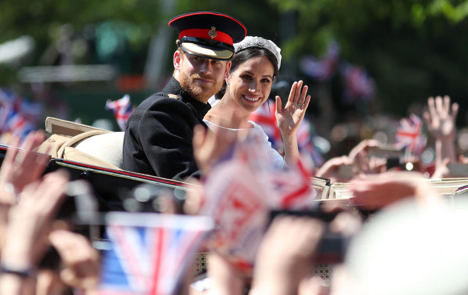 Image: Britain's Prince Harry, Duke of Sussex and his wife Meghan, Duchess of Sussex wave from the Ascot Landau Carriage during their carriage procession on the Long Walk as they head back towards Windsor Castle (Daniel Leal-Olivas / AFP via Getty Images)