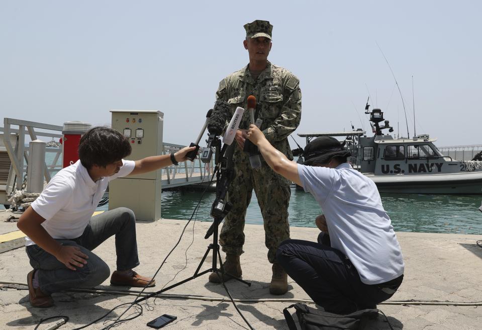 Cmdr. Sean Kido of the U.S. Navy's 5th Fleet speaks to journalists at a 5th Fleet Base, during a trip organized by the Navy for journalists, near Fujairah, United Arab Emirates, Wednesday, June 19, 2019. Kido said Wednesday that the limpet mine used on a Japanese-owned oil tanker last week "bears a striking resemblance" to similar Iranian mines. (AP Photo/Kamran Jebreili)