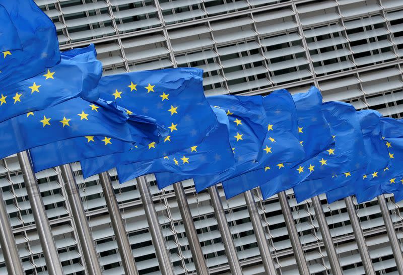 FILE PHOTO: European Union flags flutter outside the European Commission headquarters in Brussels