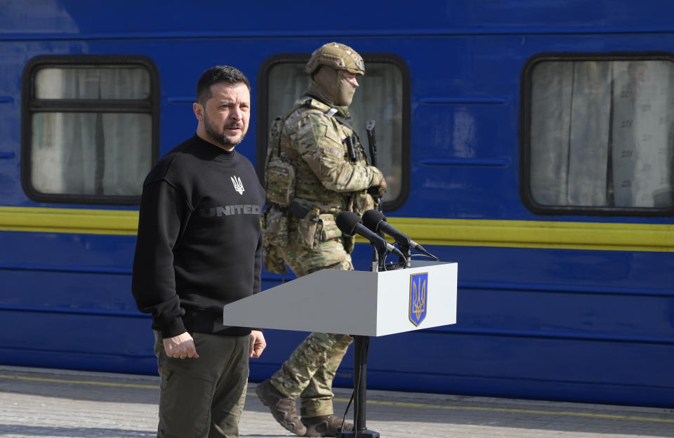 Ukrainian President Volodymyr Zelenskyy speaks during a visit to the train station in Trostianets in the Sumy region of Ukraine, Tuesday March 28, 2023. (AP Photo/Efrem Lukatsky)