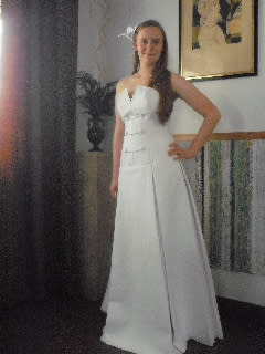 ...and please observe this pleated gown with military-inspired toilet paper buttons