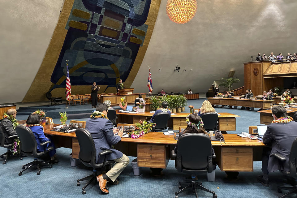 Hawaii Senate President Ron Kouchi, top center, speaks to senators at the Hawaii State Capitol on Wednesday, Jan. 17, 2024, in Honolulu. Hawaii lawmakers on Wednesday opened a new session of the state Legislature vowing to address glaring problems laid bare by the deadly wildfire that destroyed the historic town of Lahaina in August: the threat posed by wildfires and the lack of affordable housing. (AP Photo/Audrey McAvoy)