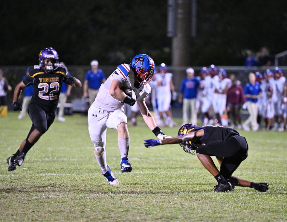 King’s Academy tight-end Cory McEnroe fights off multiple defenders en route to an impressive touchdown just before halftime during the team’s regional quarterfinals contest against Boynton Beach (Nov. 14, 2022).