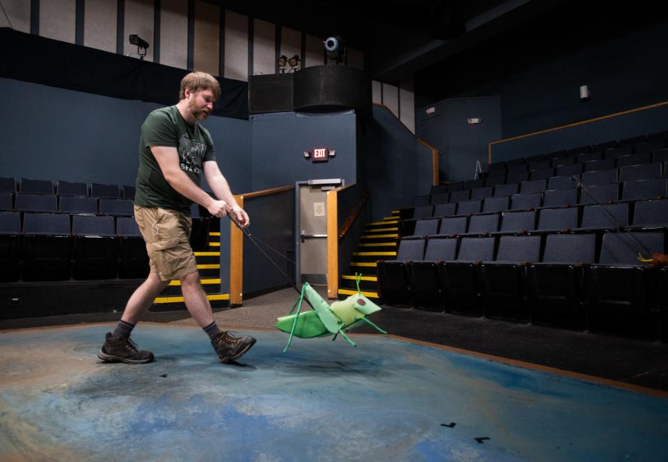 Puppet maker Adam Carlson demonstrates one of the puppets he created for Riverwalk Theatre's upcoming 'James and the Giant Peach.'