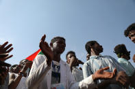 Protester gather at a demonstration, in Khartoum, Sudan, Wednesday, Oct. 21, 2020. Protesters have taken to the streets in the capital and across the country over dire living conditions and a deadly crackdown on demonstrators in the east earlier this month. Sudan is currently ruled by a joint civilian-military government, following the popular uprising that toppled longtime autocrat Omar al-Bashir last year. (AP Photo/Marwan Ali)