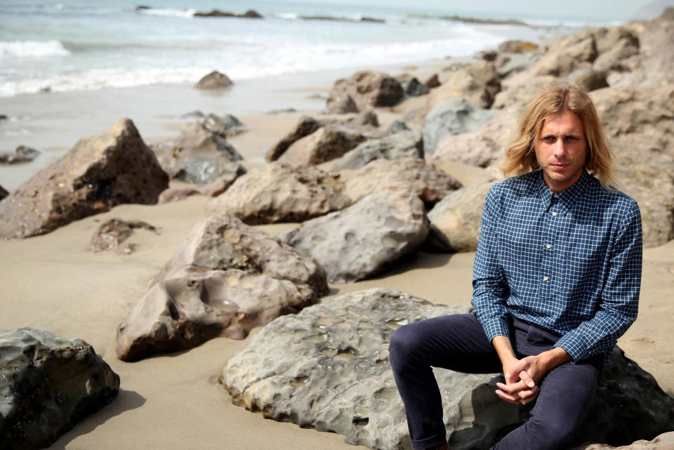 This March 11, 2014 photo shows musician Aaron Bruno of Awolnation in Malibu, Calif. Awolnation’s haunting song, “Sail,” has sold 5 million tracks and the sleeper hit is the second longest running song on the Billboard Hot 100 chart with 79 weeks. The band is currently working on the follow-up to their gold-selling 2011 debut, “Megalithic Symphony.”(Photo by Matt Sayles/Invision/AP)