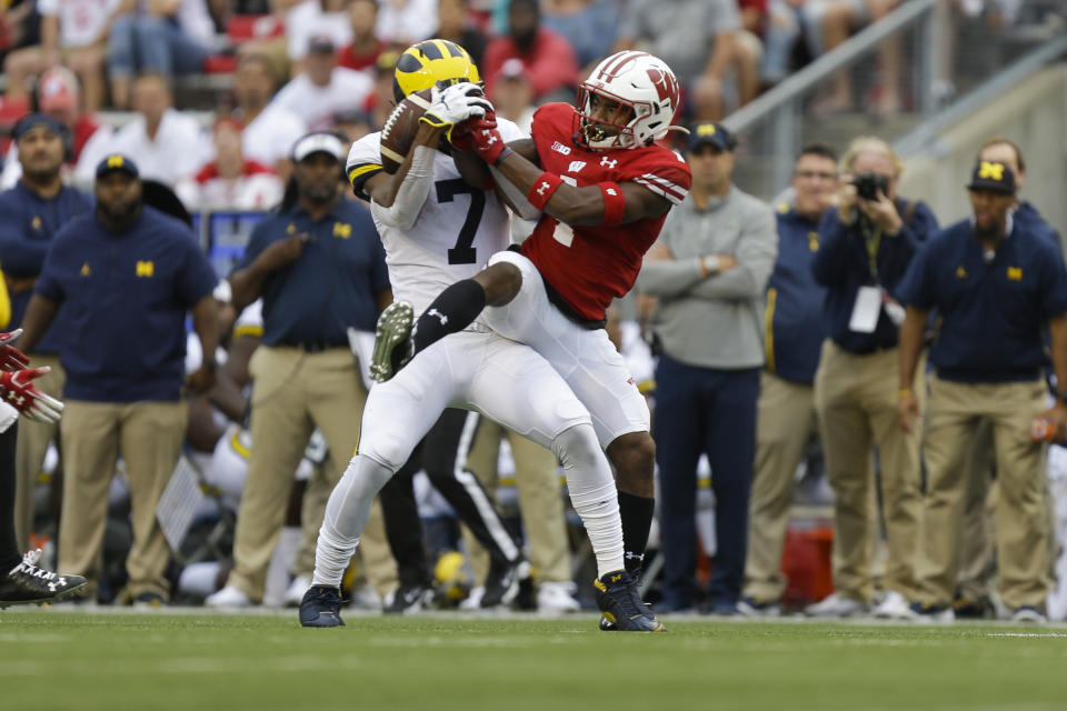 CORRECTS SCORE TO 35-14-Wisconsin linebacker Spencer Lytle, right, breaks up a pass intended for Michigan wide receiver Tarik Black during the second half of an NCAA college football game Saturday, Sept. 21, 2019, in Madison, Wis. Wisconsin won 35-14. (AP Photo/Andy Manis)