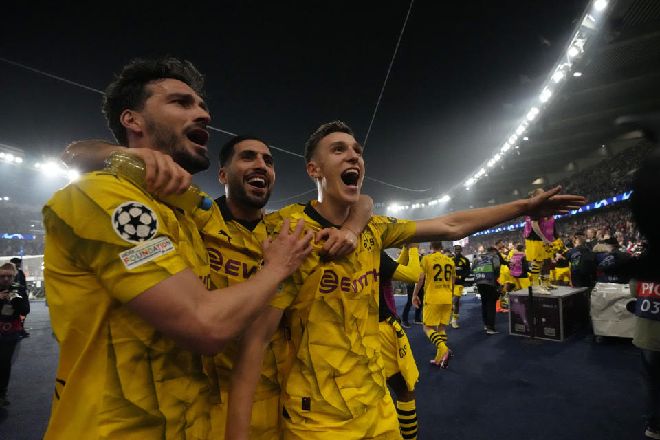 Borussia Dortmund players celebrate at the end of the Champions League semifinal second leg soccer match between Paris Saint-Germain and Borussia Dortmund at the Parc des Princes stadium in Paris, France, Tuesday, May 7, 2024. (AP Photo/Frank Augstein)