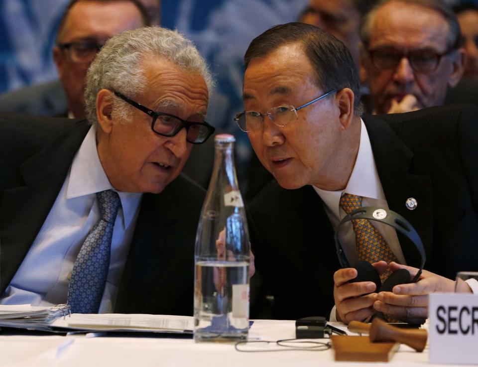 U.N. special envoy for Syria Brahimi speaks to U.N. Secretary-General Ban at the opening of the Geneva-2 peace conference in Montreux