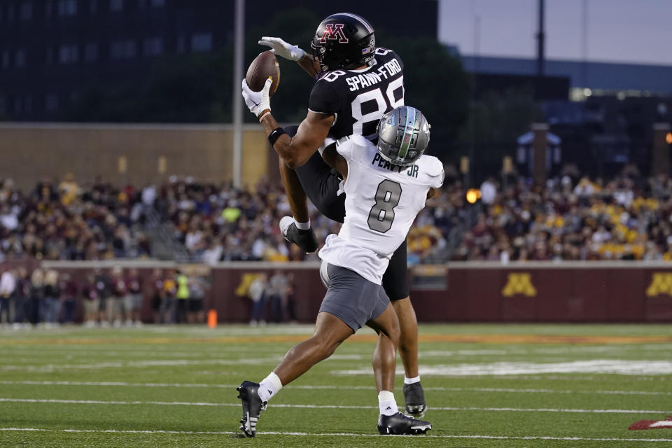 Minnesota tight end Brevyn Spann-Ford (88) catches a pass while defended by Eastern Michigan defensive back T.J. Peavy (8) during the first half of an NCAA college football game Saturday, Sept. 9, 2023, in Minneapolis. (AP Photo/Abbie Parr)