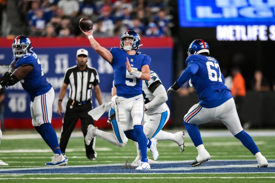 Aug 18, 2023; East Rutherford, New Jersey, USA; New York Giants quarterback Tommy DeVito (5) throws a pass against the Carolina Panthers during the fourth quarter at MetLife Stadium. Mandatory Credit: John Jones-USA TODAY Sports