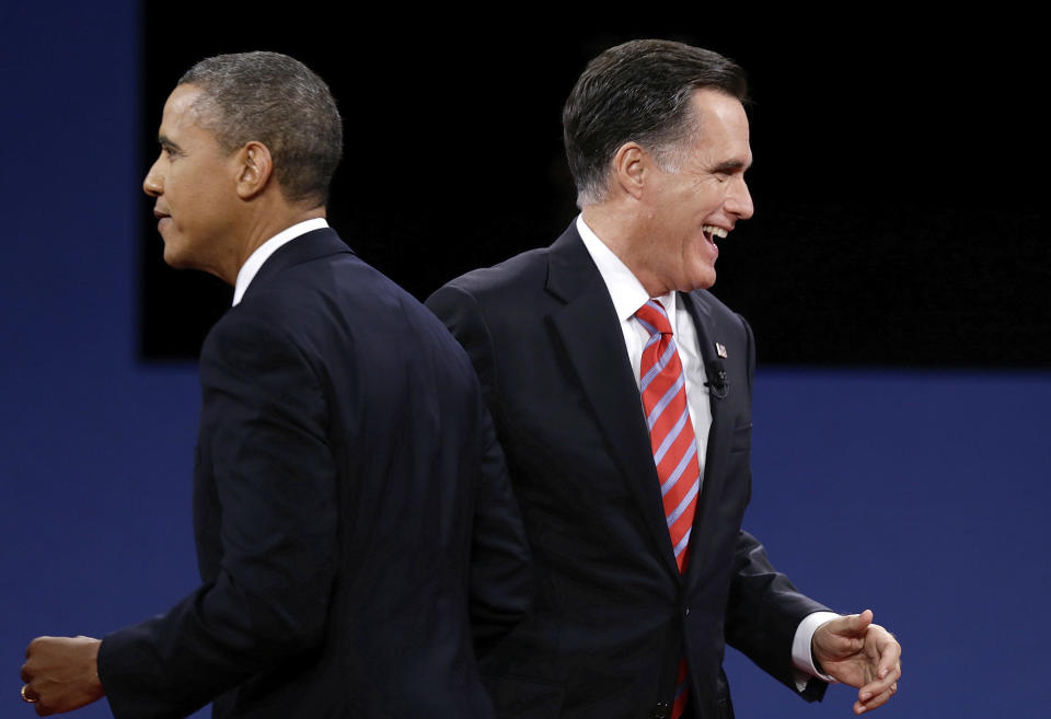 President Barack Obama and Republican presidential nominee Mitt Romney pass each other after the third presidential debate at Lynn University, Monday, Oct. 22, 2012, in Boca Raton, Fla. (AP Photo/Charlie Neibergall)