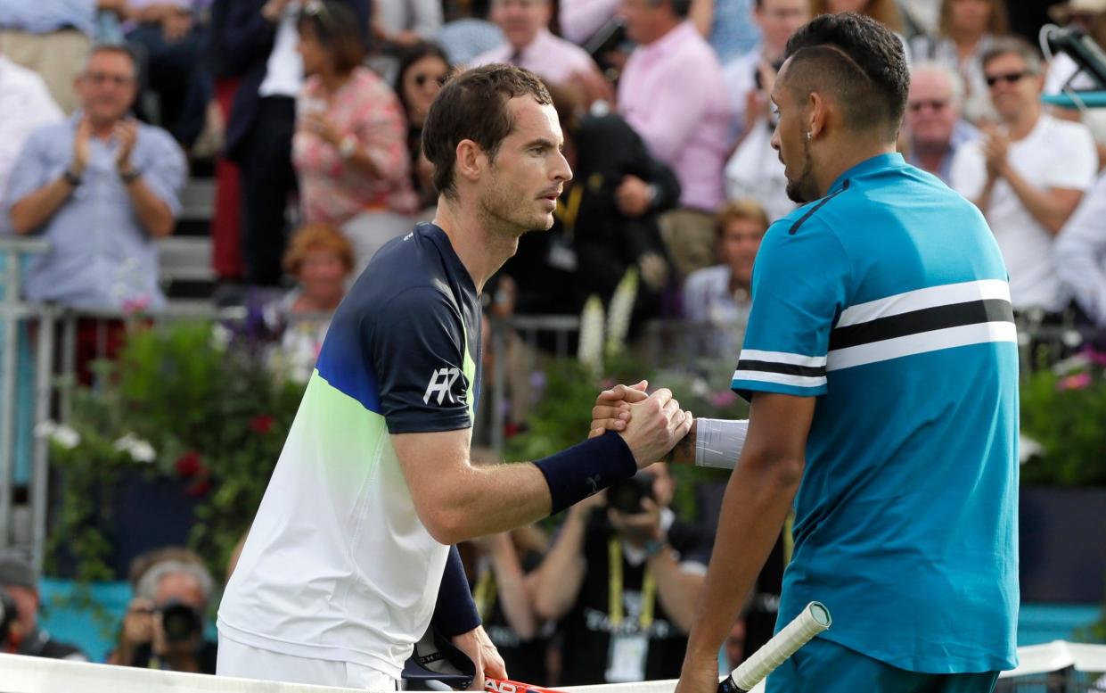 Nick Kyrgios and Andy Murray shake hands at the end of their match at Queen's last year  - AP