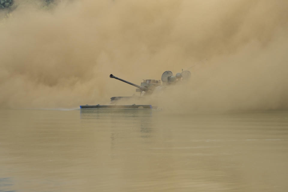 South Korea's K21 infantry fighting vehicle sails to shores in a smoke during the combined wet gap crossing military drill between South Korea and the United States as a part of the Ulchi Freedom Shield military exercise in Cheorwon, South Korea, on Aug. 31, 2023. (AP Photo/Lee Jin-man)