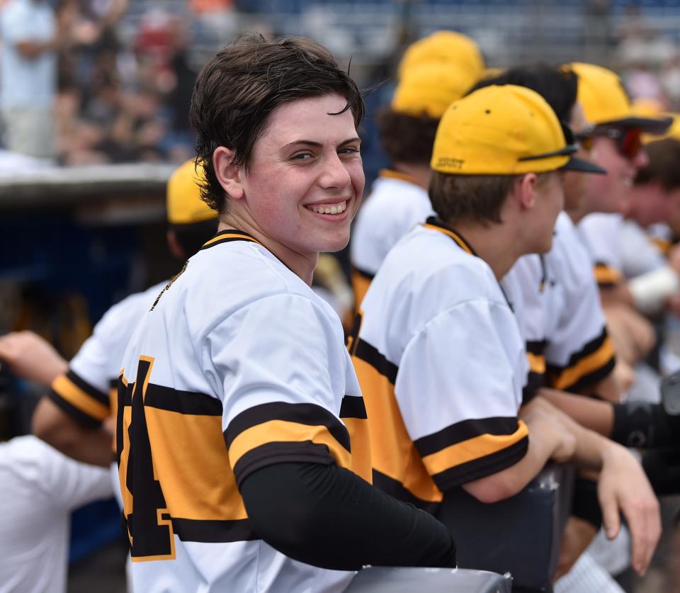 Starting pitcher Matt Wilmarth relaxes in the McQuaid dugoutPhoto by:Scotty Haines