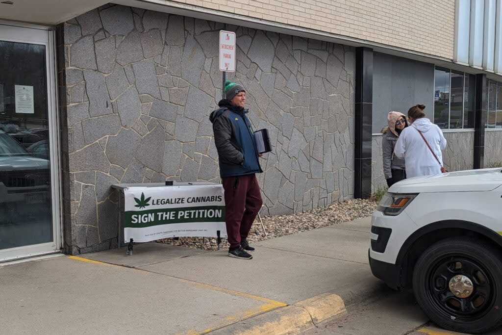 Luke Tuttle collects signatures at the Minnehaha County Administration Building on April 18, 2024 for an initiated measure that would let voters decide whether to legalize recreational marijuana in South Dakota. (John Hult/South Dakota Searchlight)