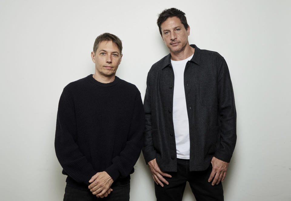 Filmmaker Sean Baker, left, poses with actor Simon Rex in New York on Nov. 29, 2021 to promote their film "Red Rocket." (Photo by Matt Licari/Invision/AP)
