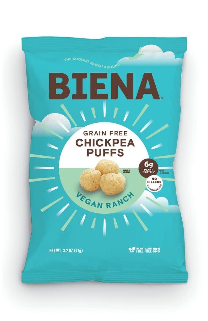 A turquoise bag that says "grain free chickpea puffs" on it
