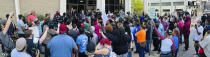 Scores of demonstrators gather in front of the Elizabeth City, N.C., City Hall on Wednesday evening, April 21, 2021, to protest the police involved shooting earlier in the day. A North Carolina deputy shot and killed a Black man while executing a search warrant Wednesday, authorities said, spurring an outcry from a crowd of dozens that immediately gathered at the scene and demanded law enforcement accountability. (Stephen M. Katz