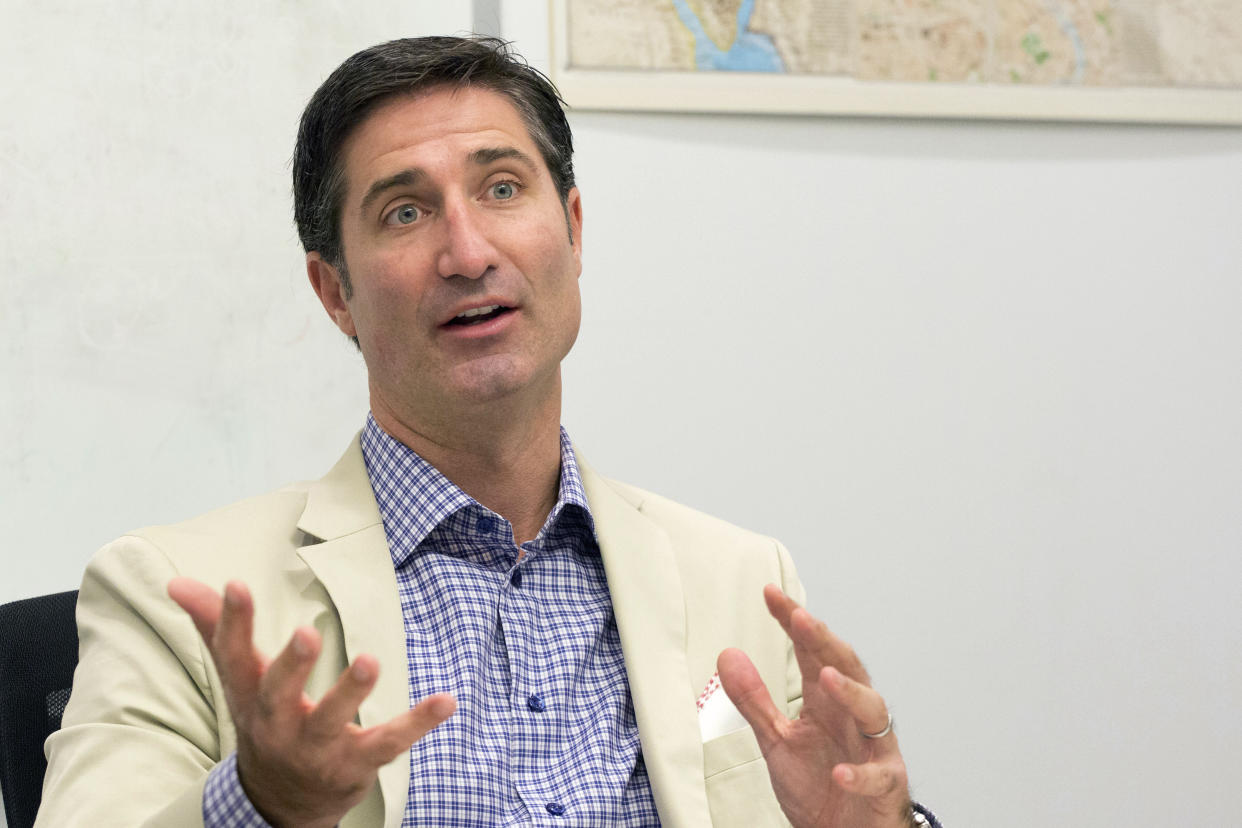 FILE- In this June 9, 2015, file photo, Taco Bell CEO Brian Niccol speaks during an interview at The Associated Press in New York. Chipotle Mexican Grill announced Tuesday, Feb. 13, 2018, that its Board of Directors has appointed Niccol as chief executive officer and a member of the Board, effective March 5, 2018. (AP Photo/Mark Lennihan, File)