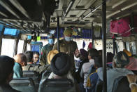 Indian police man wearing surgical masks is seen talking to the passangers for aware for coronavirus at screening camp in Lakhanpur - 92 kms from Jammu - in India.