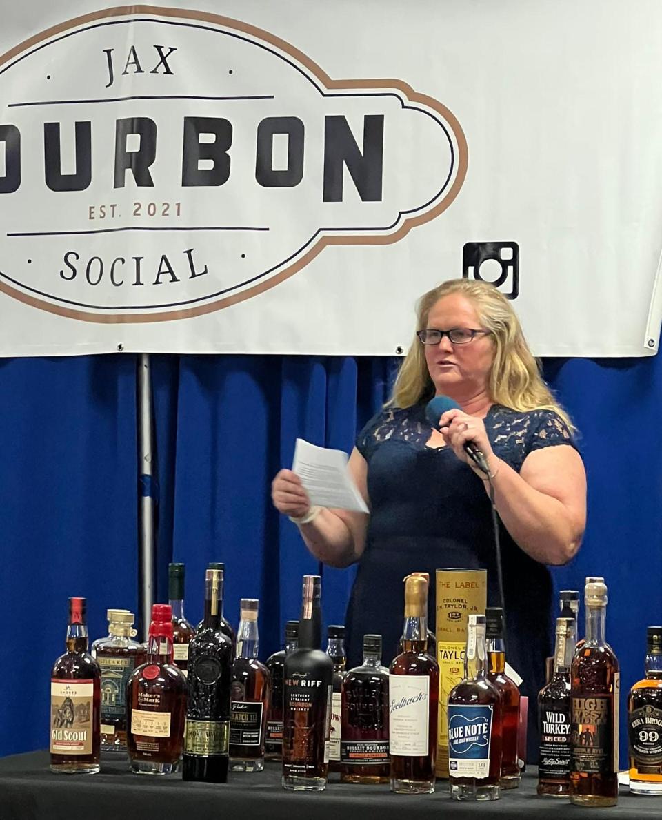 Founder Teresa Eichner leads the auction at Jax Bourbon Social's fundraiser for the National MS Society on Aug. 30. She was diagnosed with MS in 2016.