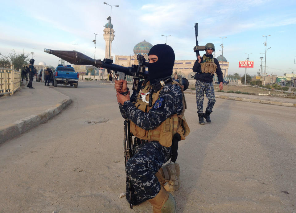 FILE - In this Saturday, Feb. 1, 2014, file photo, Iraqi security forces patrol in Ramadi, Iraq. More than a month after jihadist militants seized control of parts of Iraq’s western Anbar province, an unsettling realization is sinking in: Iraq’s government could face a tougher time beating back an insurgency there than the hard slog the Americans faced last decade. The reasons include a deep distrust of the government by Iraqi Sunnis, insufficient resources, sectarian tensions enflamed by the war in Syria and divisions among the tribes that make up Anbar’s social fabric. (AP Photo, File)