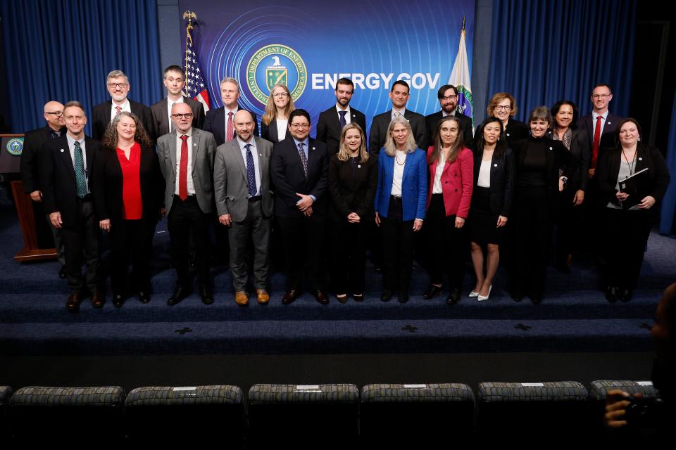 Scientists, engineers and administrators from the Lawrence Livermore National Laboratories pose for a group photograph at the Department of Energy (Getty Images)