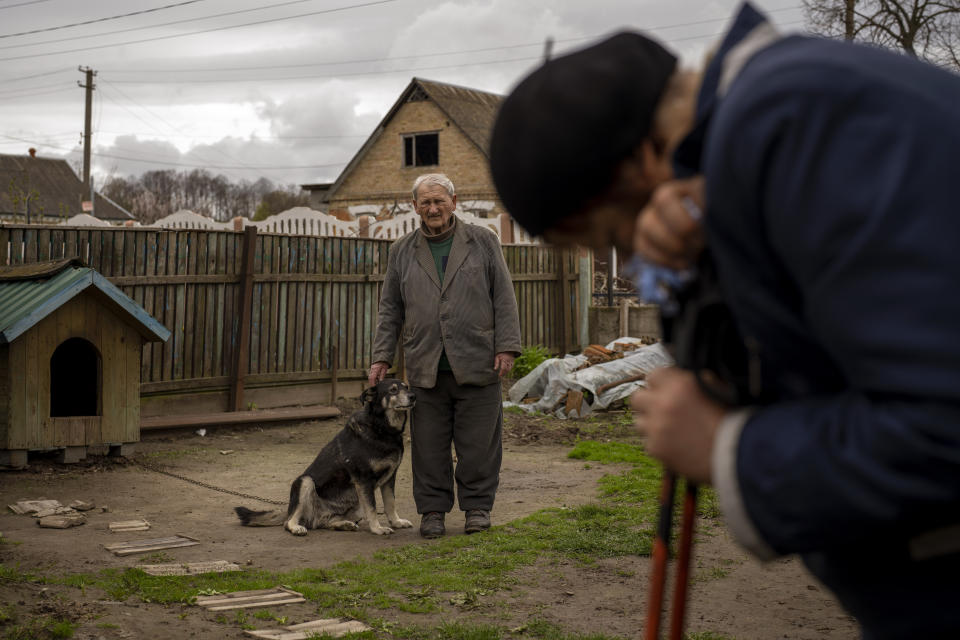 Petro Volin'ko, 87, attends the funeral of his neighbour Mykola Moroz, 47, at his home at the Ozera village, near Bucha, Ukraine on Tuesday, April 26, 2022. Mykola was captured by Russian army from his house in the Ozera village on March 13, taken for several weeks in an unknown location and finally found killed with gunshots about 15 kilometres from his house. (AP Photo/Emilio Morenatti)